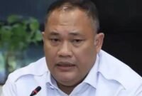 Seorang pria berbicara di depan mikrofon dalam sebuah forum. (Foto: Jemmy Setiawan)